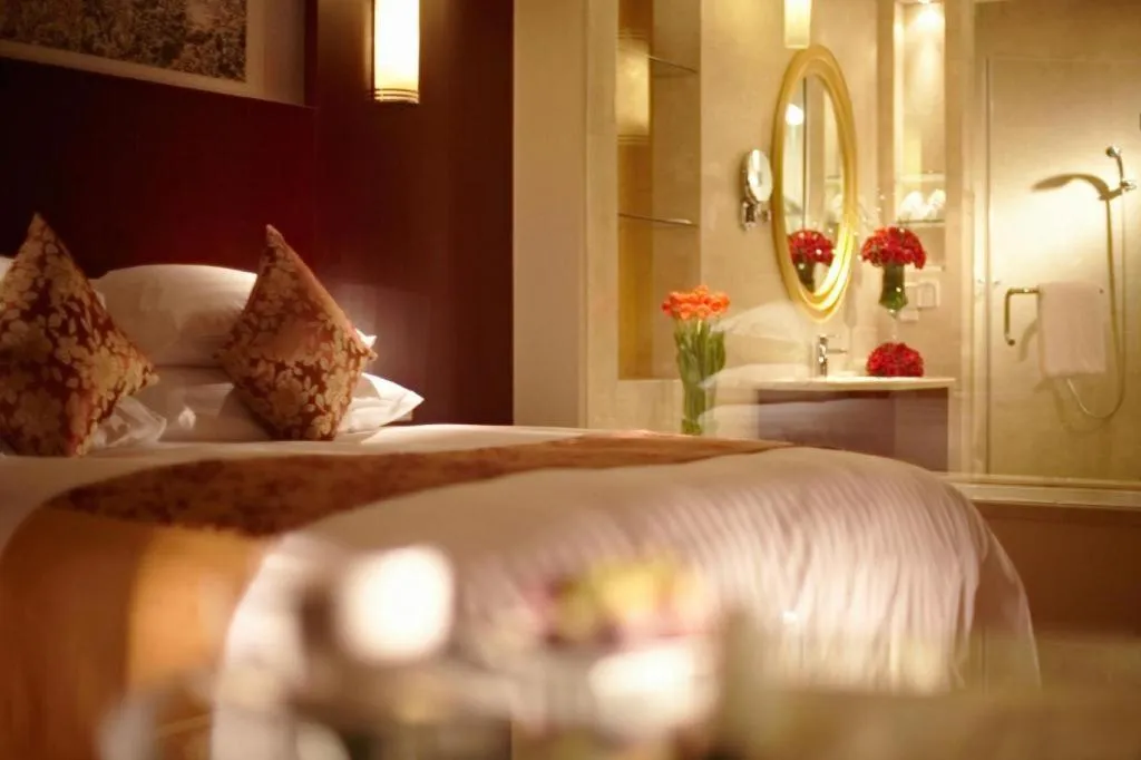 Bed in New Century Hotel Zaozhuang Fengming