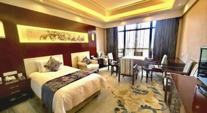 Bed in New Century Hotel Zaozhuang Fengming
