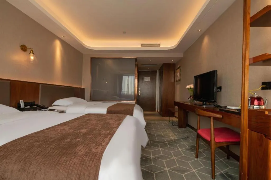 Bed in Guilin Plaza Hotel