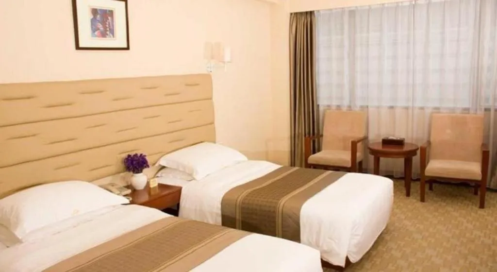 Bed in Guilin Plaza Hotel