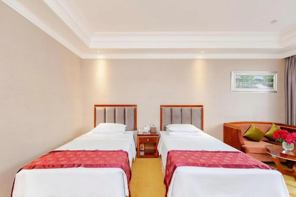 Bed in Xinjin Celebrity City Hotel