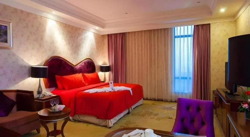 Bed in Xinjin Celebrity City Hotel