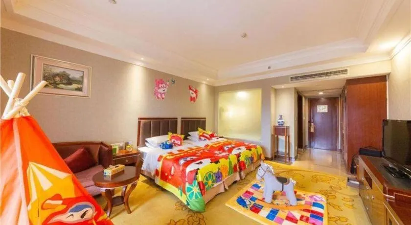 Bed in Xinjin Celebrity City Hotel