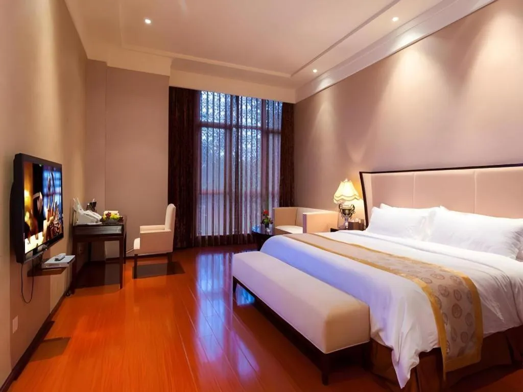 Bed in Xinjin Celebrity City Hotel