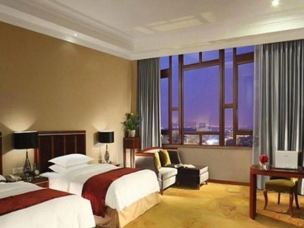 Bed in Xinjin Celebrity City Hotel