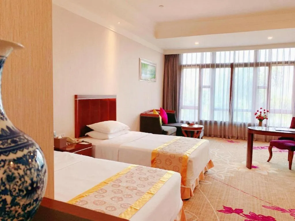 Bed in Xinjin Celebrity City Hotel