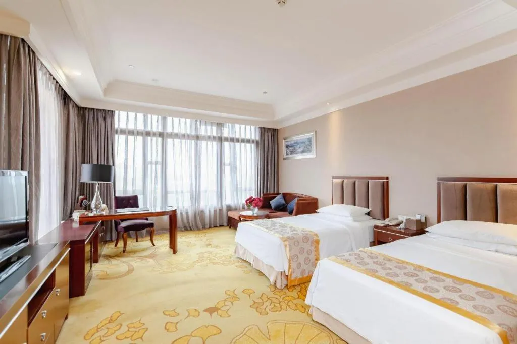 Bed in Xinjin Celebrity City Hotel