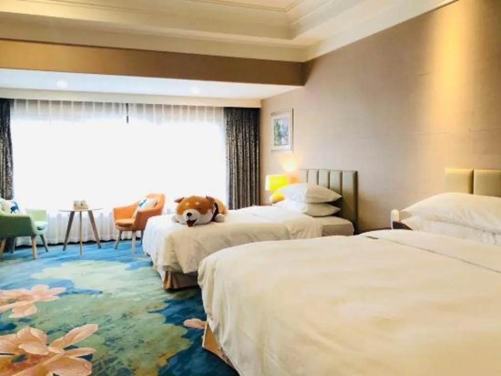 Bed in Xinjin Celebrity City Hotel