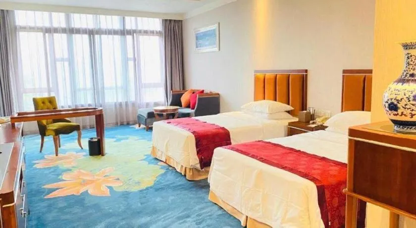 Bed in Xinjin Celebrity City Hotel