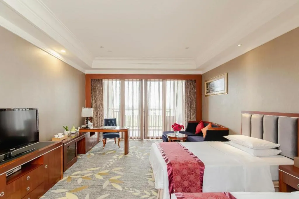 Bed in Xinjin Celebrity City Hotel