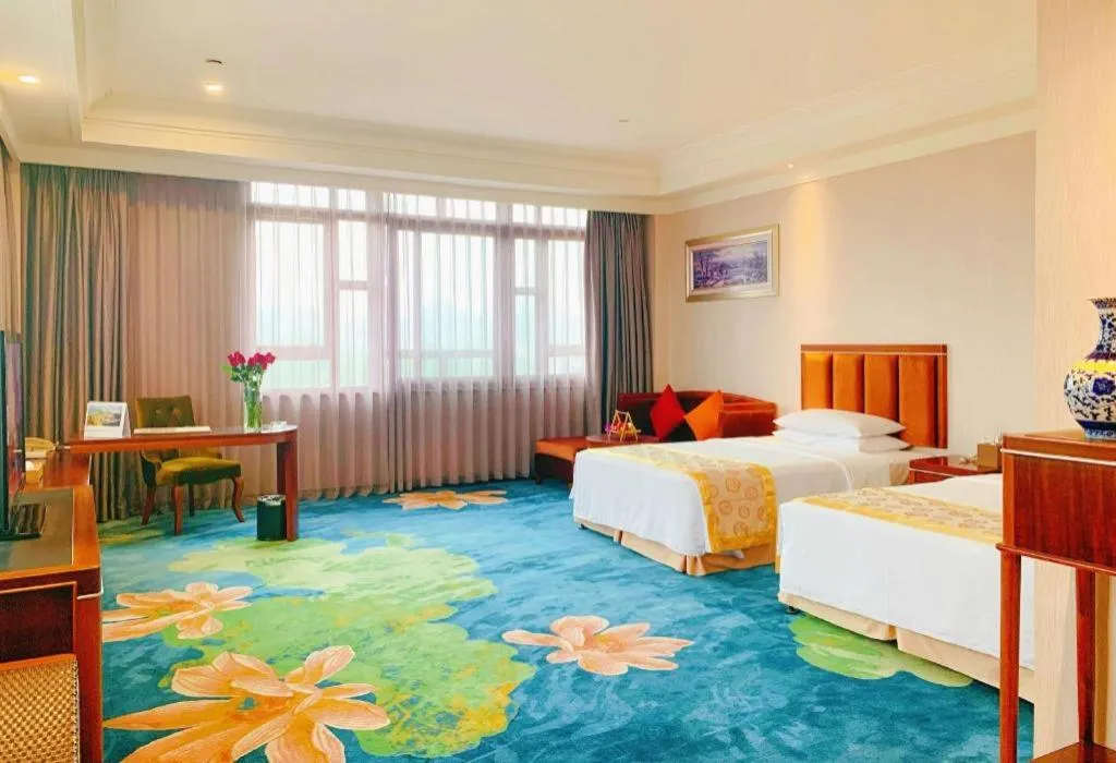 Bed in Xinjin Celebrity City Hotel