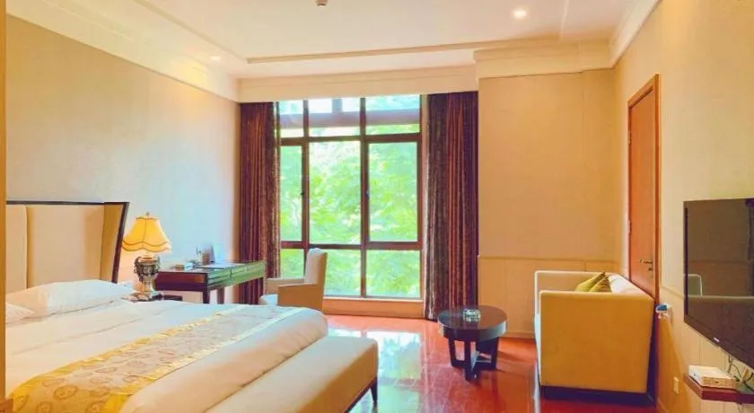 Bed in Xinjin Celebrity City Hotel