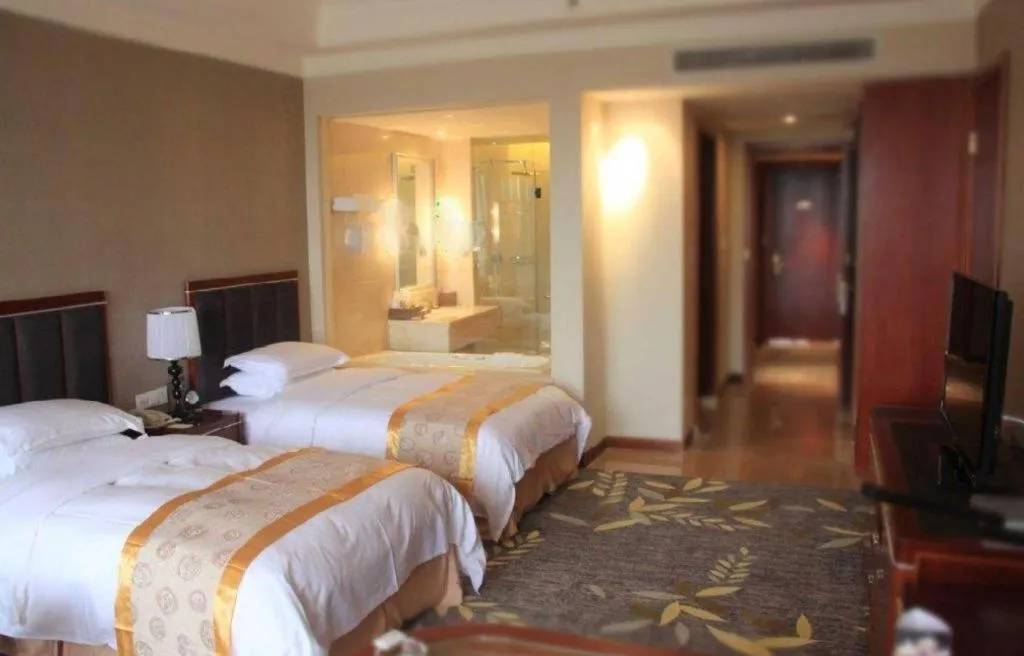 Bed in Xinjin Celebrity City Hotel