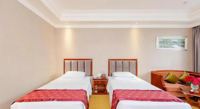 Bed in Xinjin Celebrity City Hotel