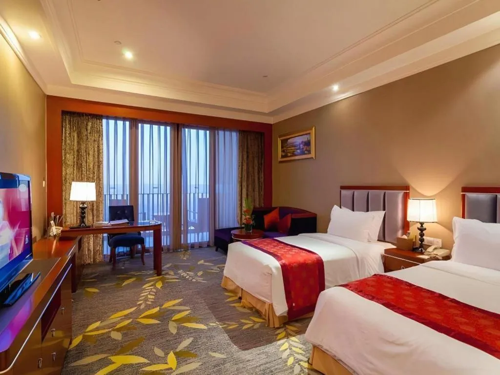 Bed in Xinjin Celebrity City Hotel