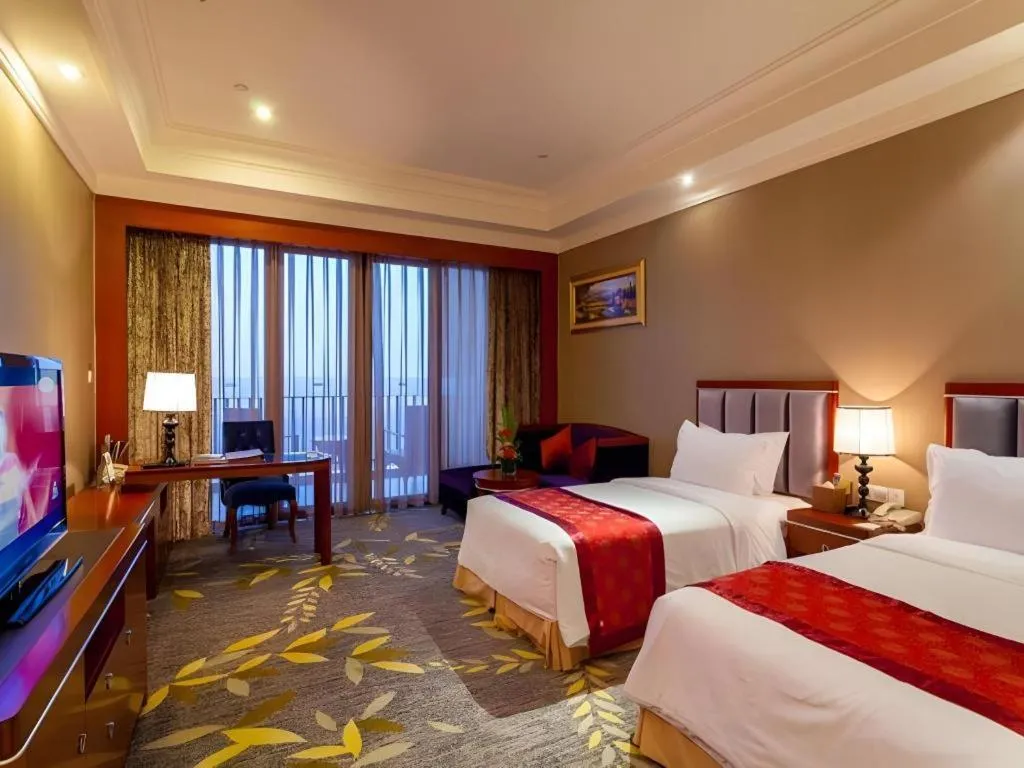 Bed in Xinjin Celebrity City Hotel