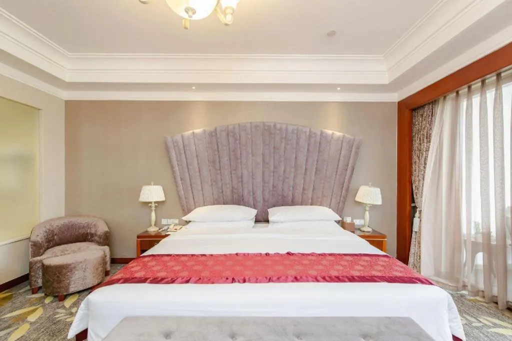 Bed in Xinjin Celebrity City Hotel