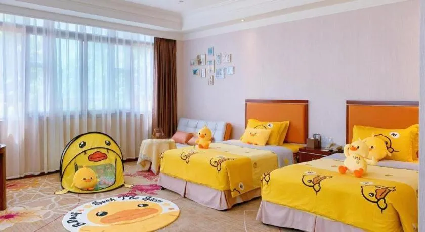 Bed in Xinjin Celebrity City Hotel