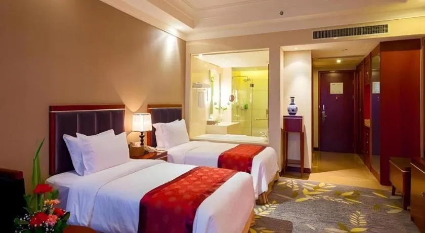 Bed in Xinjin Celebrity City Hotel