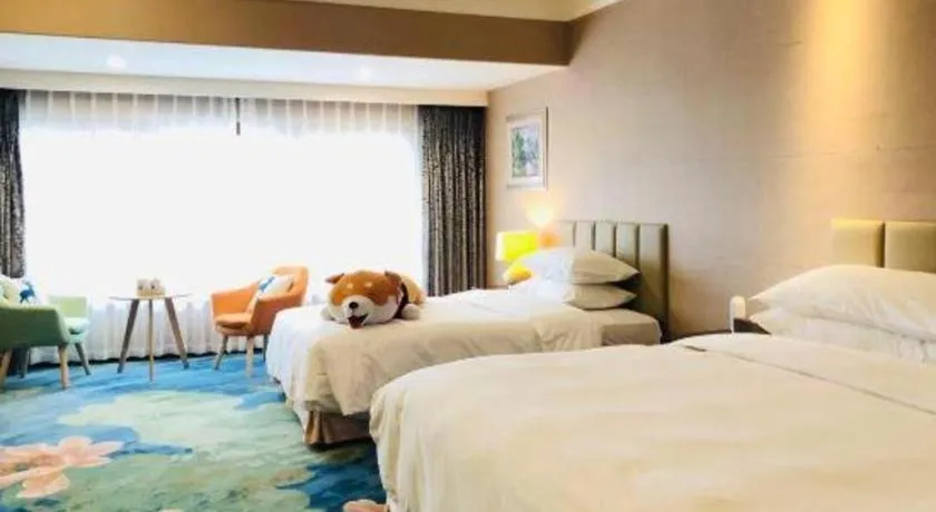 Bed in Xinjin Celebrity City Hotel