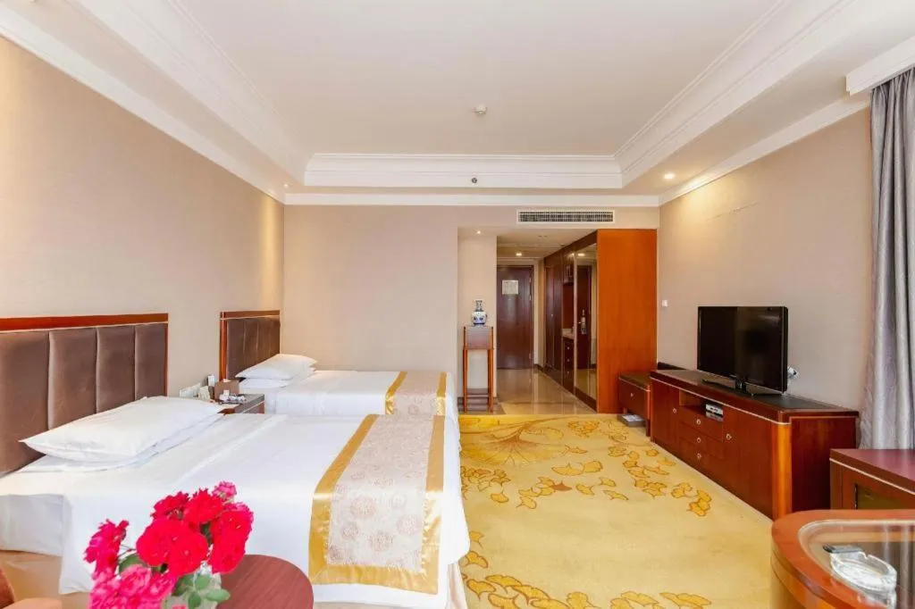 Bed in Xinjin Celebrity City Hotel