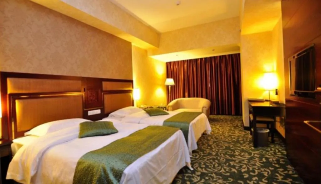 Bed in Economic Trade Hotel