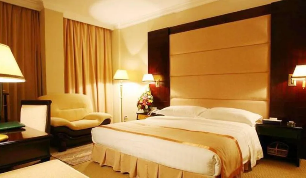 Bed in Economic Trade Hotel