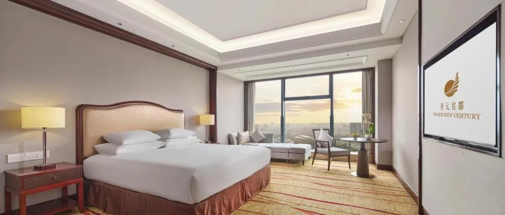Bed in New Century Grand Hotel Zhejiang Sanli