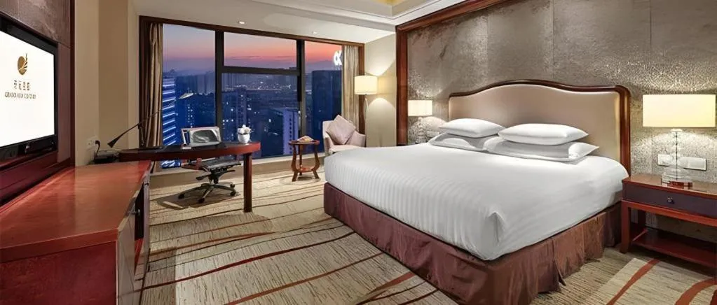 Bed in New Century Grand Hotel Zhejiang Sanli