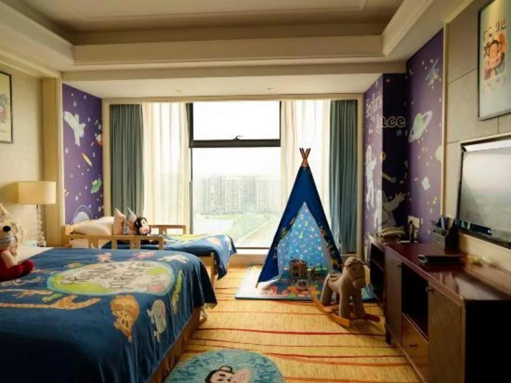 Bed in New Century Grand Hotel Zhejiang Sanli