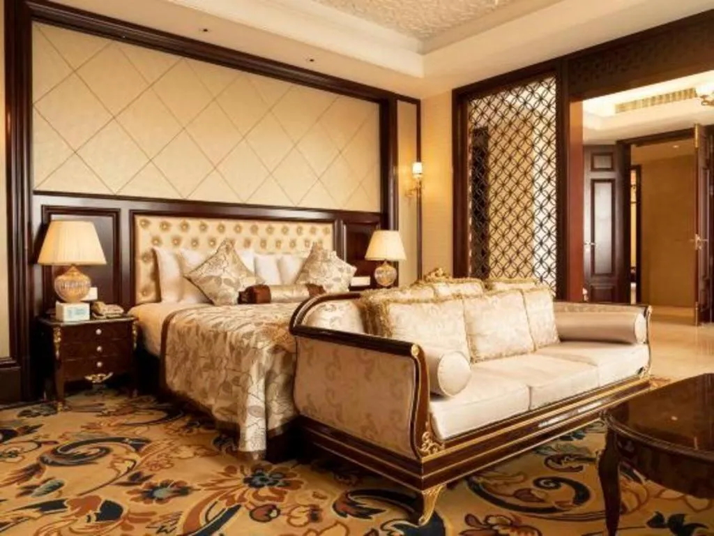 Bed in New Century Grand Hotel Zhejiang Sanli