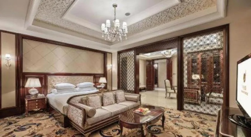 Bed in New Century Grand Hotel Zhejiang Sanli