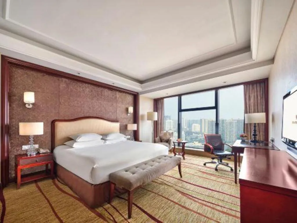 Bed in New Century Grand Hotel Zhejiang Sanli