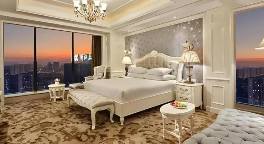Bed in New Century Grand Hotel Zhejiang Sanli