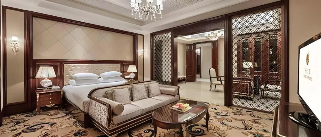 Bed in New Century Grand Hotel Zhejiang Sanli