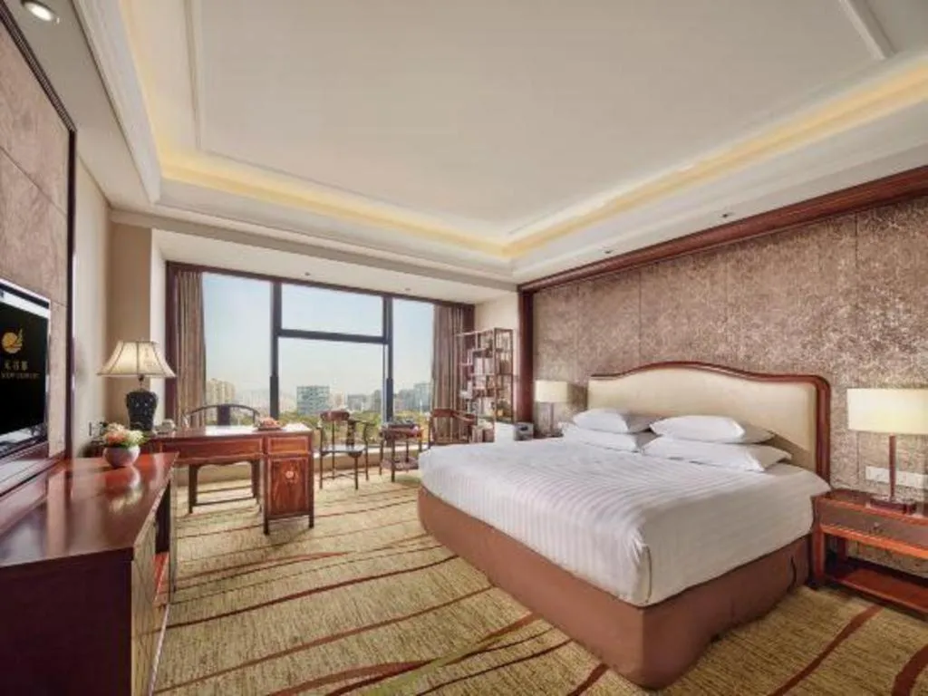 Bed in New Century Grand Hotel Zhejiang Sanli
