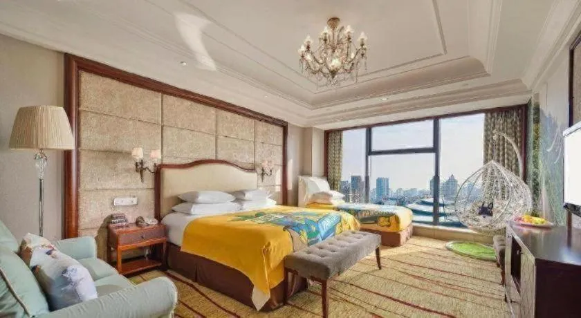 Bed in New Century Grand Hotel Zhejiang Sanli