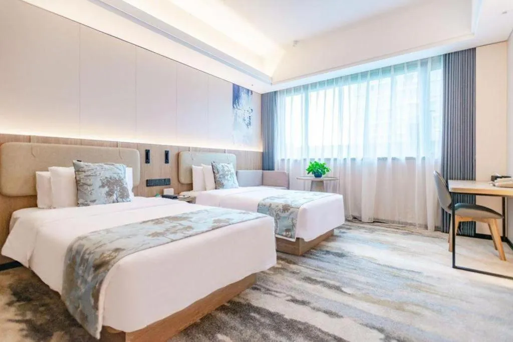 Bed in Jiaxing Fortune Holiday Hotel