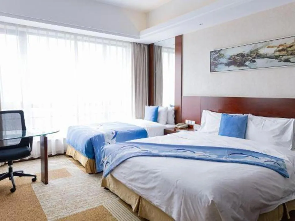 Bed in Jiaxing Fortune Holiday Hotel