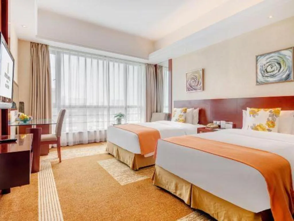 Bed in Jiaxing Fortune Holiday Hotel