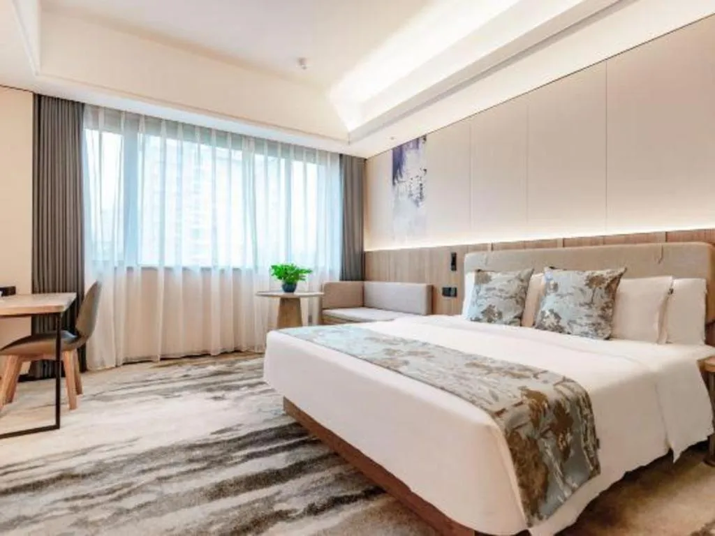 Bed in Jiaxing Fortune Holiday Hotel