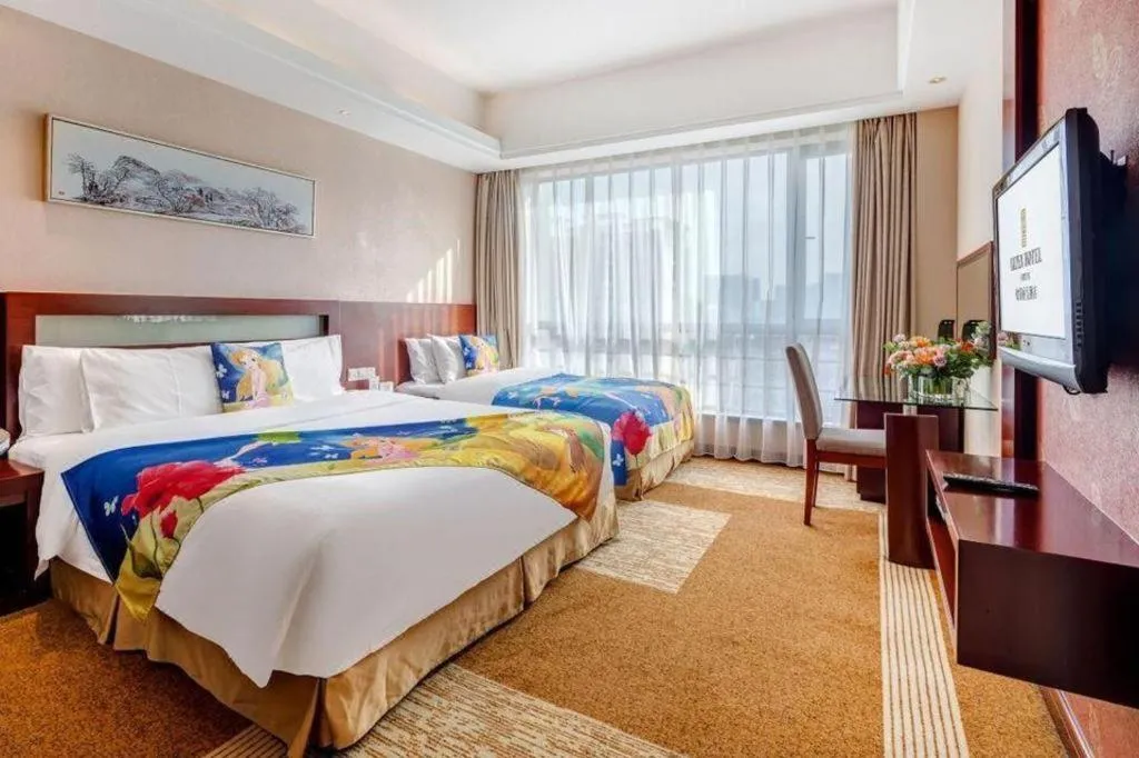 Bed in Jiaxing Fortune Holiday Hotel
