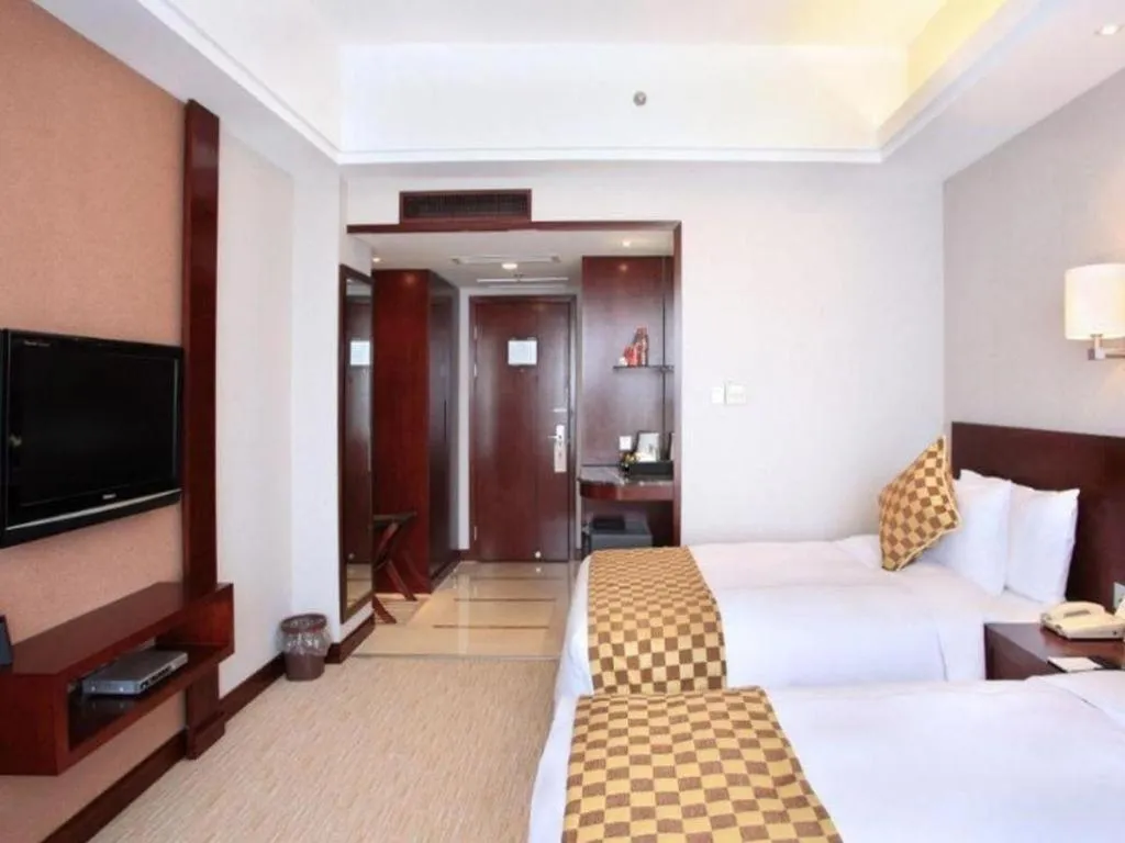 Bed in Jiaxing Fortune Holiday Hotel