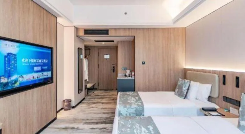 Bed in Jiaxing Fortune Holiday Hotel