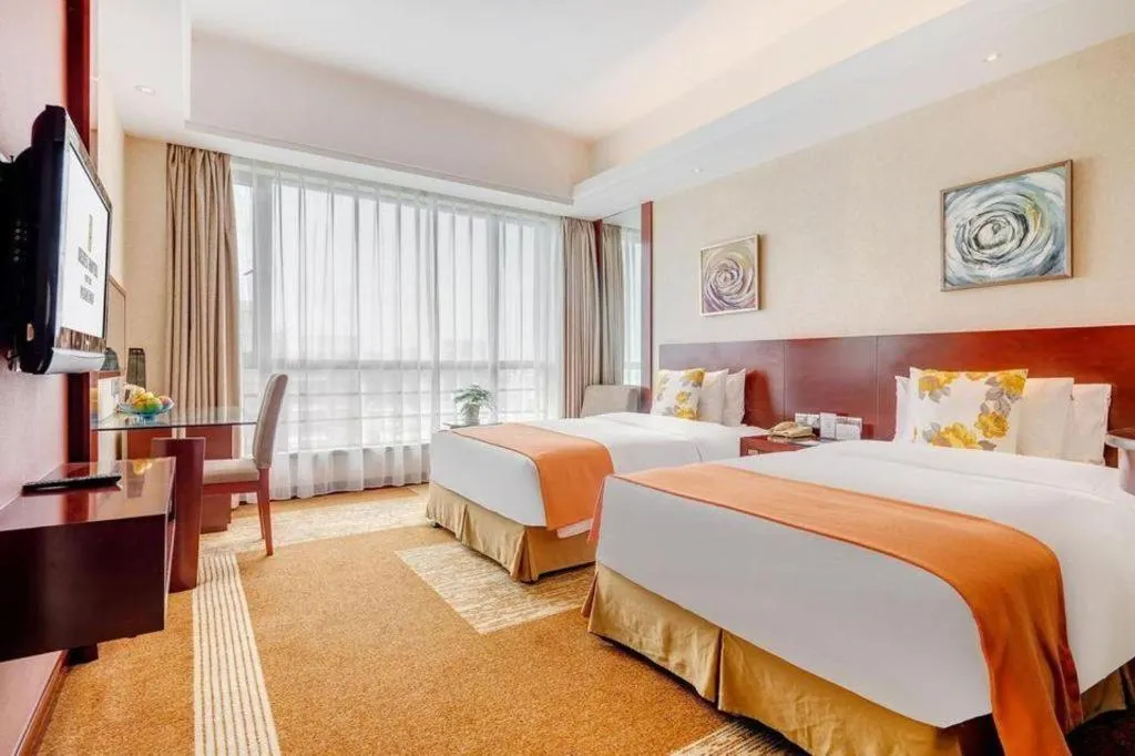 Bed in Jiaxing Fortune Holiday Hotel