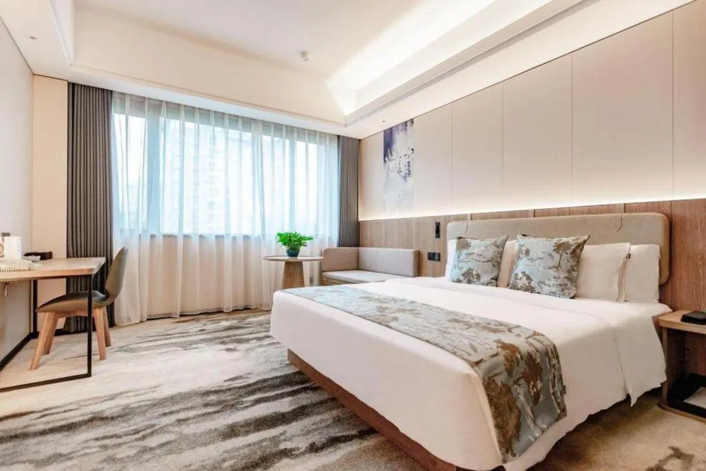 Bed in Jiaxing Fortune Holiday Hotel