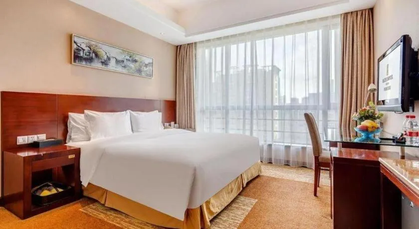 Bed in Jiaxing Fortune Holiday Hotel