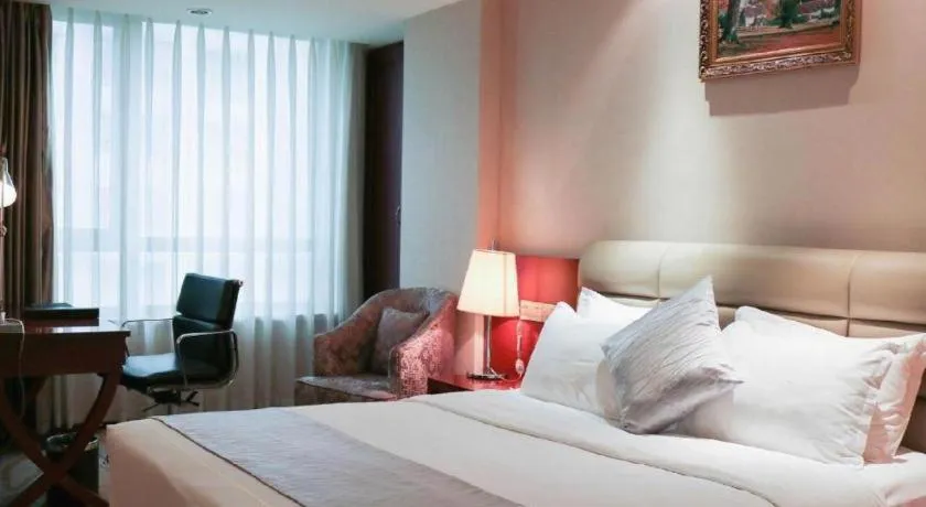 Bed in Chengdu Sovereign Hotel