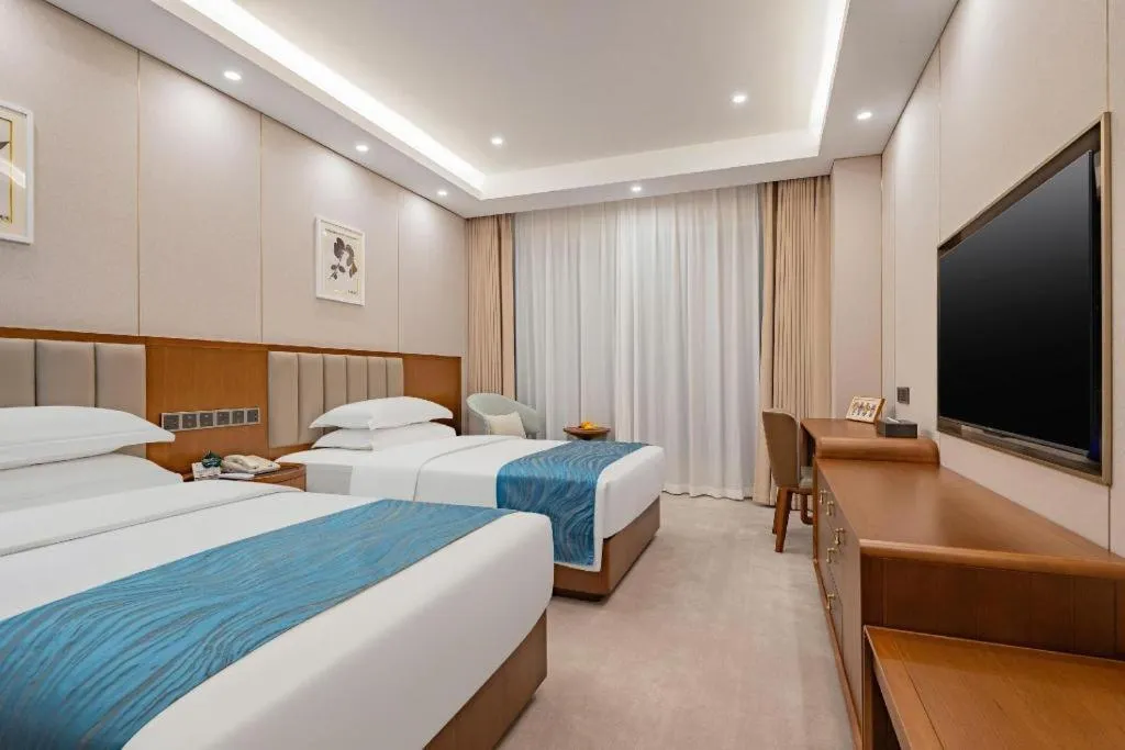 Bed in Yichang Three Gorges Project Hotel
