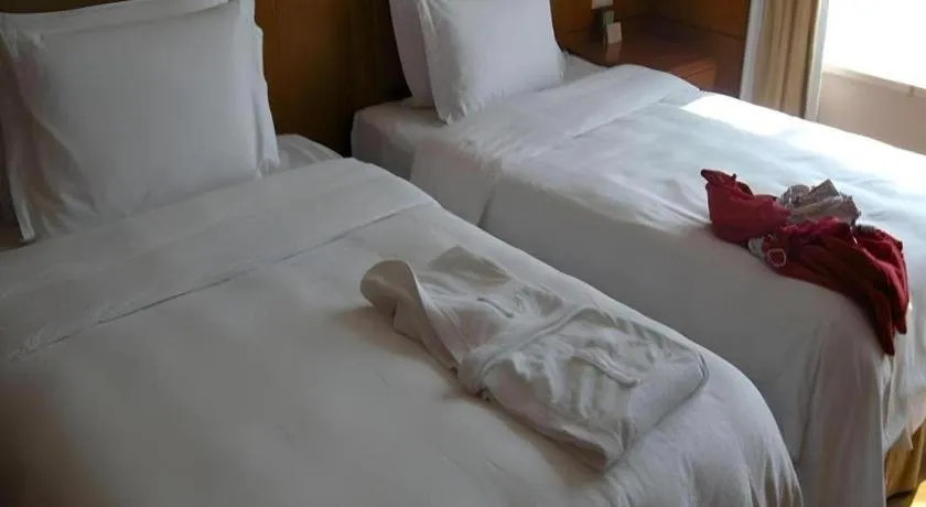 Bed in Fuyang International Trade Centre Hotel